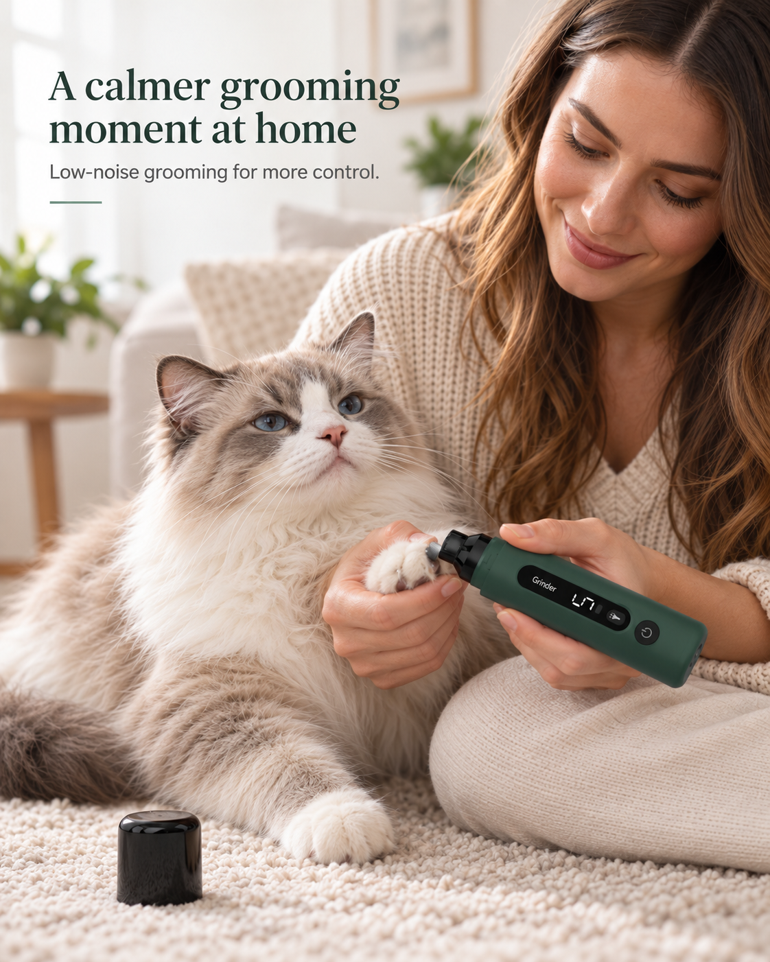 Pet parent gently using CLAWVERA nail grinder on a cat at home